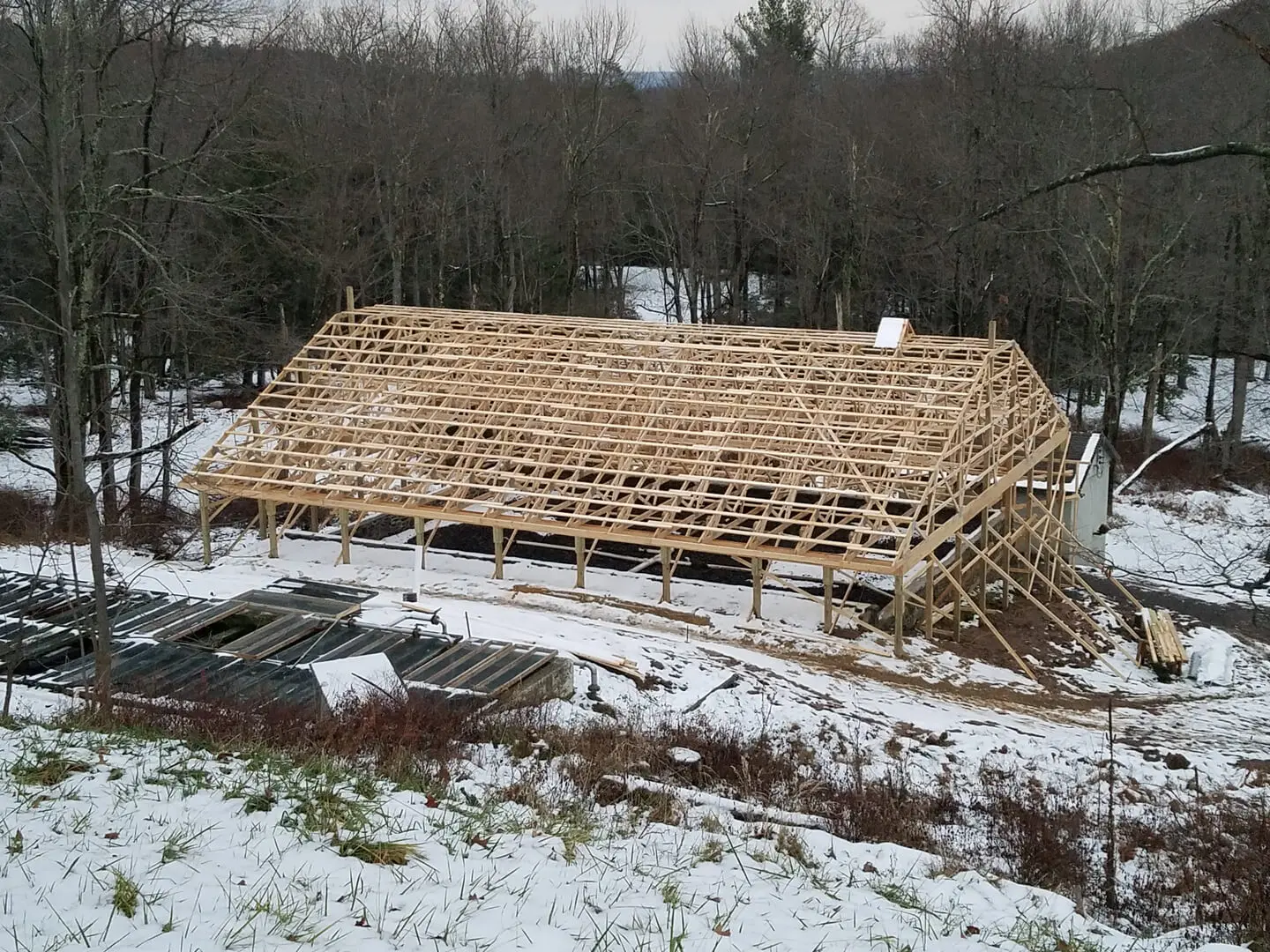 A building that is being built in the snow.