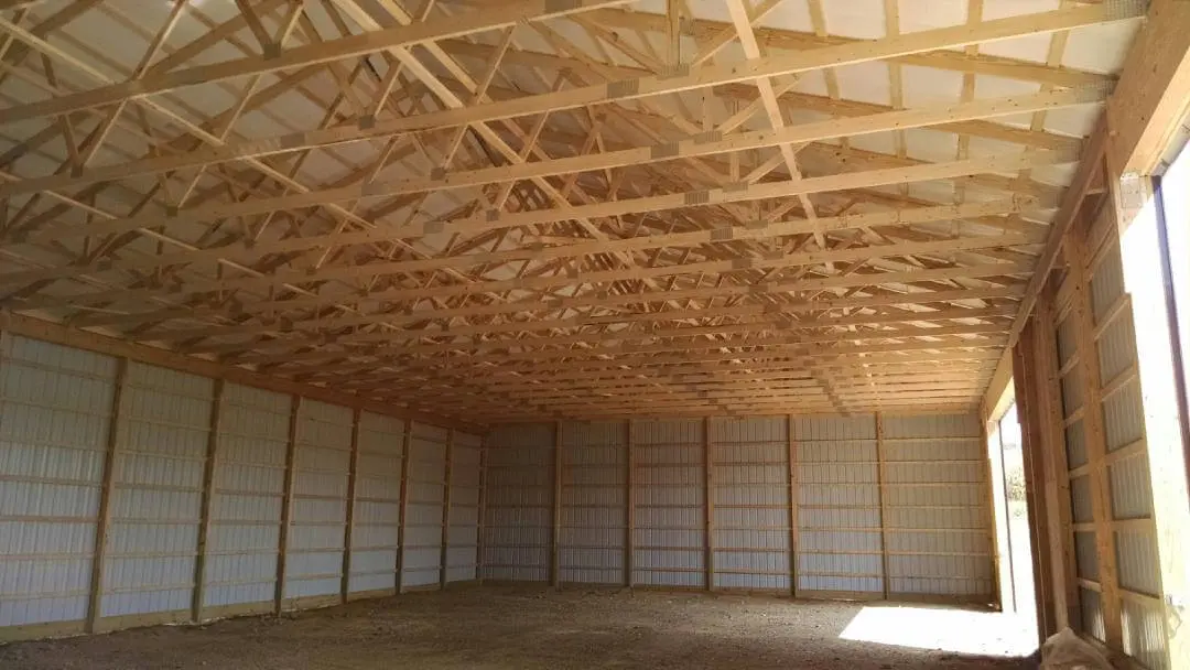 A room with many wooden beams on the ceiling.