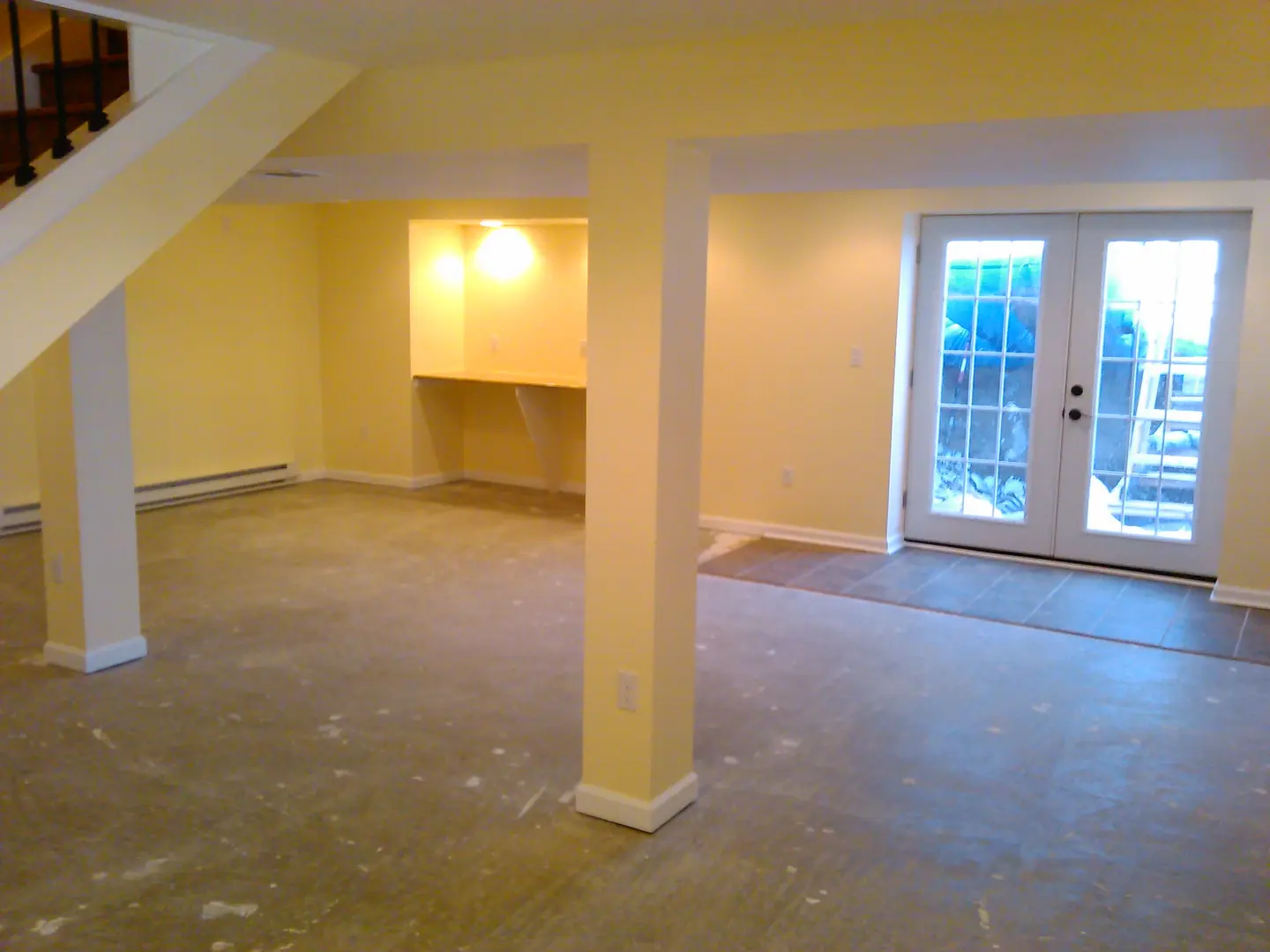 A room with yellow walls and white trim.