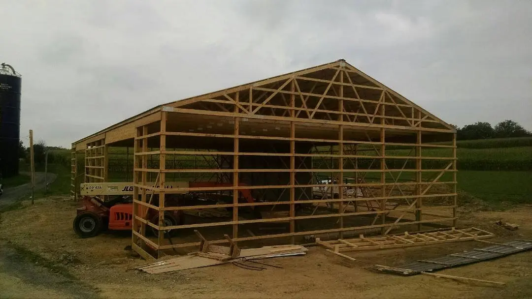 A building that is being built in the dirt.