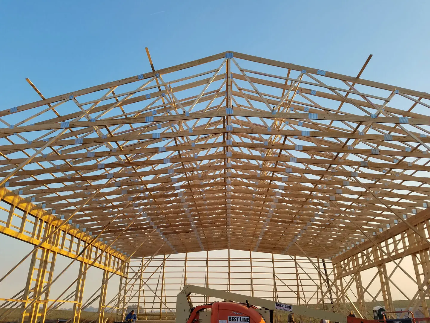 A large building with many wooden beams on it