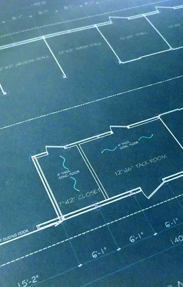 A close up of some blue prints on top of paper