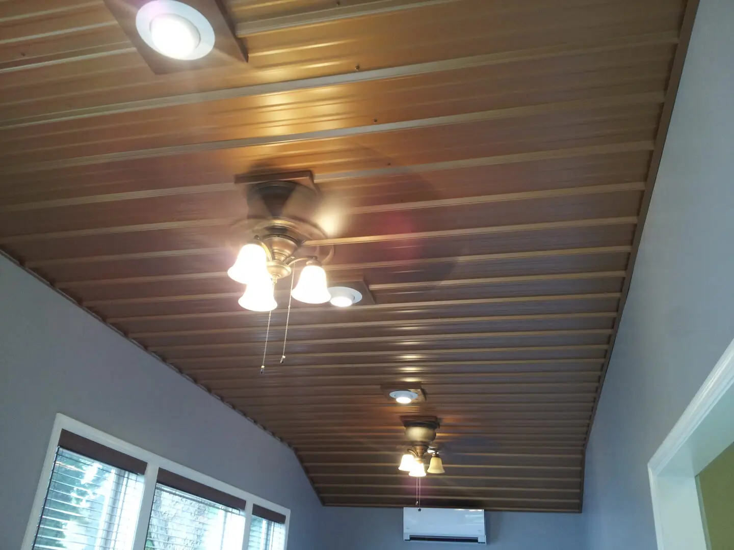 A ceiling with lights and a fan in it